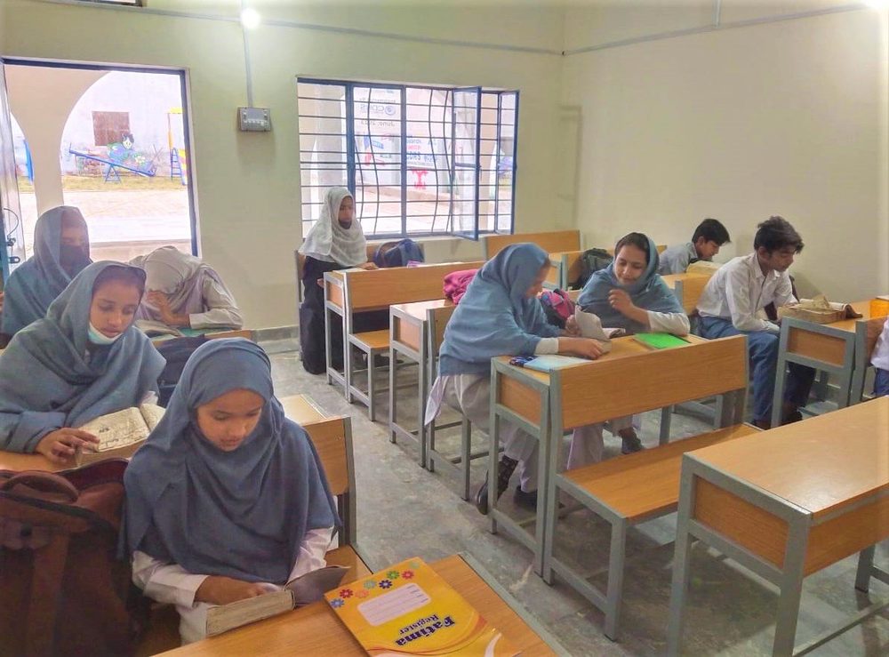 Girls studying in a CDRS built classroom