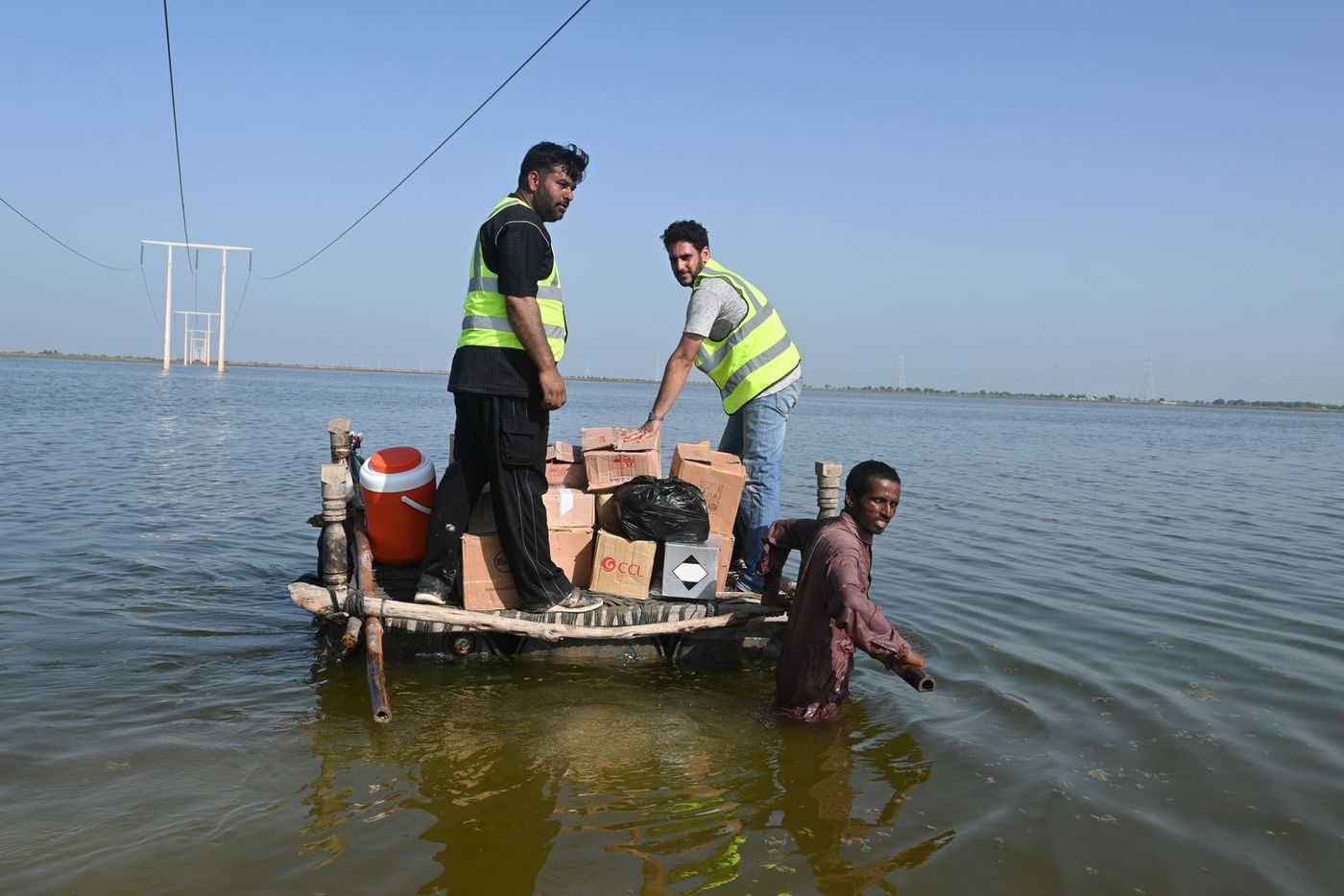 A CDRS team reaching a marooned family by boat during the Pakistan floods