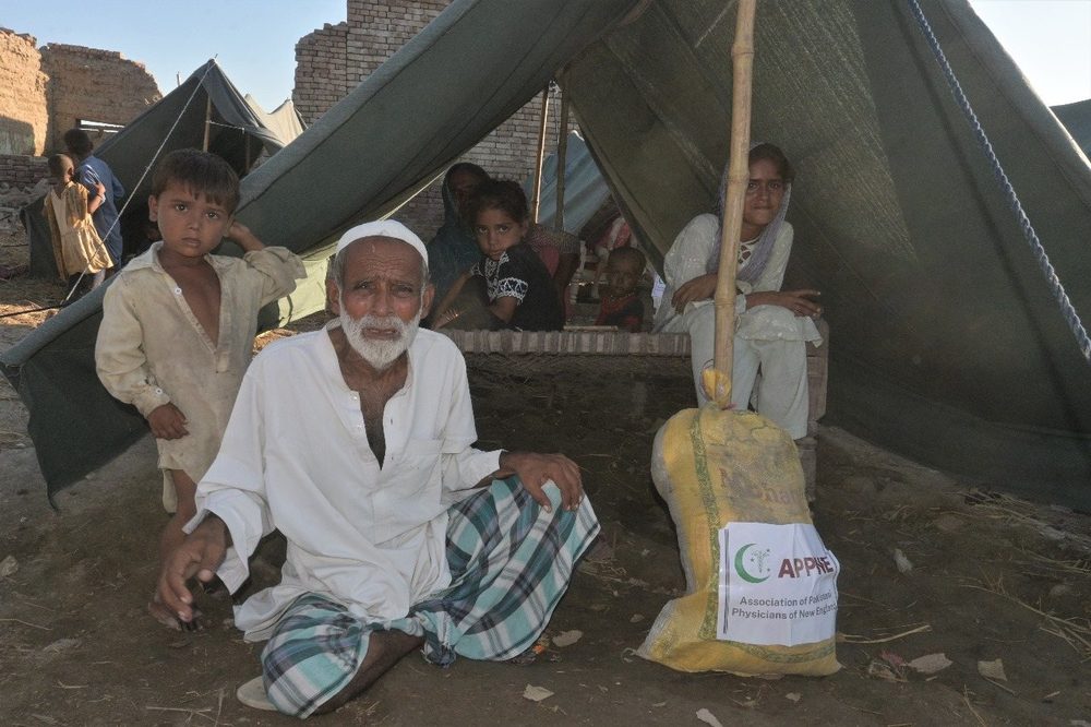 An elderly man receiving a CDRS ration pack