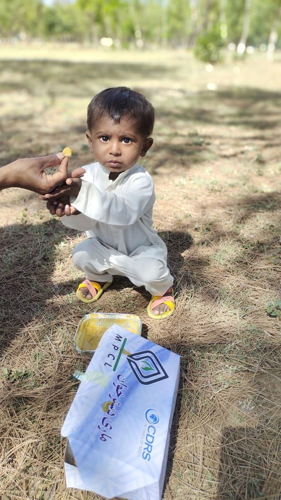 A child receiving a CDRS food package