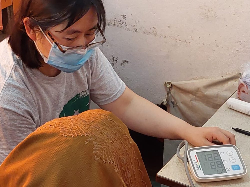 A blood pressure check at a CDRS medical camp