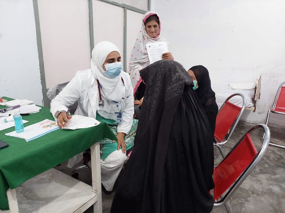 A CDRS nurse registering patients at a medical camp