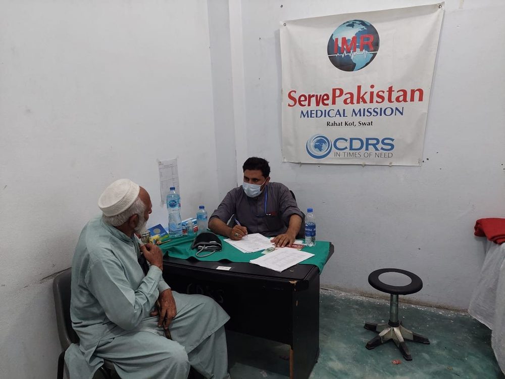 A doctor with a patient at a CDRS Serve Pakistan medical mission