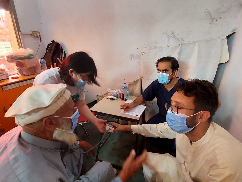 An elderly patient being examined at a CDRS medical camp