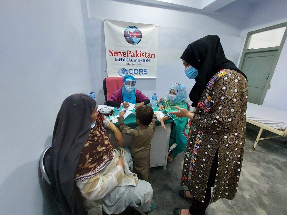 Mothers and children at a CDRS medical camp