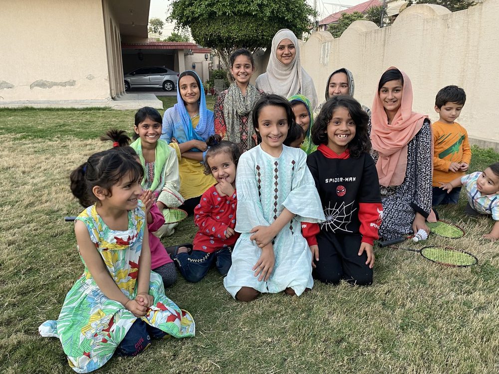 Children and house mothers on the lawn at House of Blessings