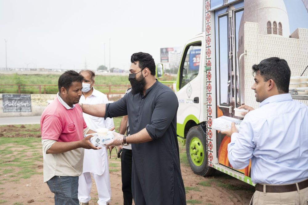 The Mari Dastarkhwan team at the distribution van